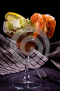 Fresh grilled Prawn cocktail served in a holiday restaurant in a margarita glass with decoration of prawn on the corner with