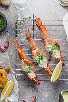 Fresh grilled shrimps served with sauce and crusty bread