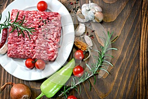 Fresh ground beef meat with seasonings - minced beef on plate