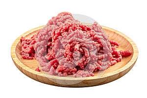 Fresh ground beef on wooden plate
