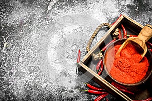 Fresh ground hot pepper in a bowl on a tray.