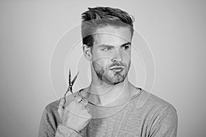 Fresh hairstyle. Barbershop concept. Barbershop salon. Personal stylist. Bearded man hold scissors. Modern barbershop