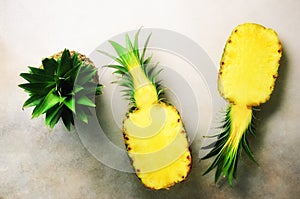 Fresh half sliced pineapple on gray background. Top View. Copy Space. Bright pineapples pattern for minimal style. Pop