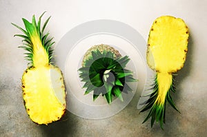 Fresh half sliced pineapple on gray background. Top View. Copy Space. Bright pineapples pattern for minimal style. Pop