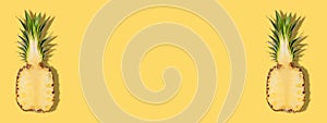 Fresh half sliced pineapple on yellow background. Creative suumer concept