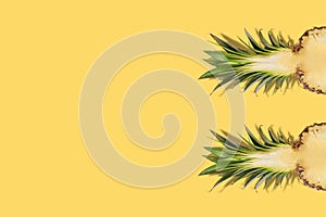 Fresh half sliced pineapple on yellow background. Creative suumer concept