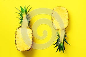 Fresh half sliced pineapple on yellow background. Top View. Copy Space. Bright pineapples pattern for minimal style. Pop