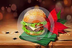 Fresh hamburger and christmas decor with poinsettia flower