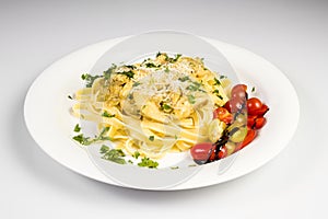 Fresh handmade tagliatelle pasta with forest mushrooms, parsley and cherry tomatoes salad