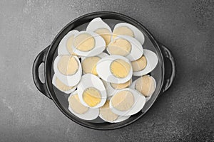 Fresh hard boiled eggs on brown table, top view