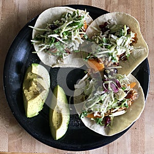 Fresh and Healthy Avocados with Cole Slaw Covered Beans and Rice Tacos