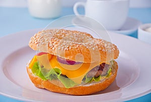 Fresh healthy bagel sandwich on a white plate