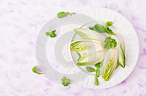 Fresh and healthy Chicory witloof Salad on a plate. Dietary menu. Healthy food.