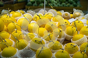 Fresh healthy fruits on shelves in supermarket