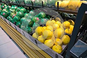 Fresh healthy fruits on shelves in supermarket