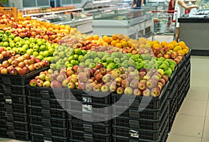 Fresh healthy fruits on shelves in supermarket