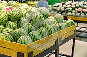 Fresh healthy fruits on shelves in supermarket