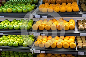 Fresh healthy fruits on shelves in supermarket