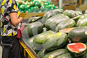 Fresh healthy fruits on shelves in supermarket