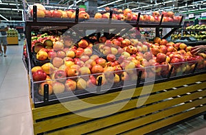 Fresh healthy fruits on shelves in supermarket