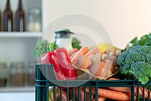 Fresh healthy groceries and vegetables from supermarket in green tray box. Food delivery service