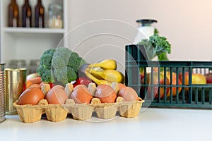 Fresh healthy groceries and vegetables from supermarket in green tray box. Food delivery service