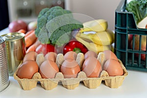 Fresh healthy groceries and vegetables from supermarket in green tray box. Food delivery service