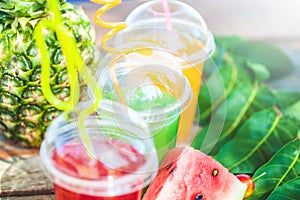 Fresh healthy juices, fruit, pineapple, watermelon on the background of the sea. Summer, rest, healthy lifestyle Copy