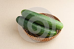 Fresh and healthy organic cucumbers served on bamboo plate