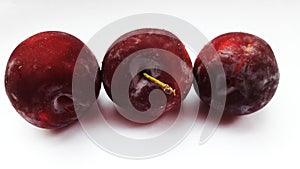 fresh healthy plum isolated on white background closeup