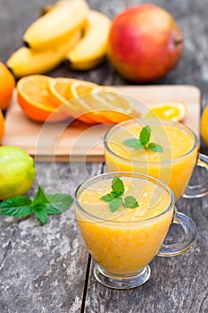 Fresh healthy pulpy juice with orange fruits and vegetables