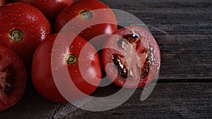 Fresh and Healthy Ripe Red Tomatoes on wooden Table.