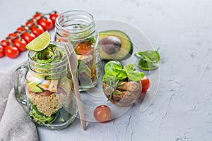 Fresh healthy salad in glass jar and ingredients