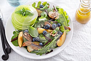 Fresh healthy salad with greens and apple