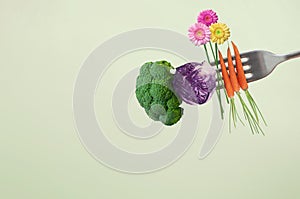 Fresh healthy spring food on fork concept