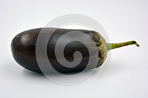 Fresh and healthy vegetables from breast, blue, purple eggplants located on a white background.