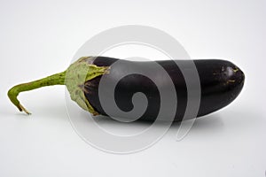 Fresh and healthy vegetables from breast, blue, purple eggplants located on a white background.