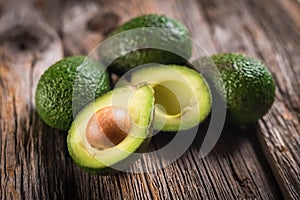 Fresh healty avocado on wooden background