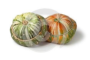 Fresh heirloom orange and green Turban squashes