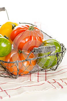 Fresh heirloom tomatoes in a basket