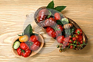 Fresh heirloom tomatoes on wooden table
