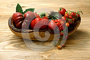 Fresh heirloom tomatoes on wooden table