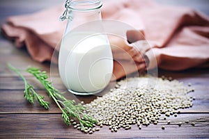 fresh hemp seeds spilling from a bag with hemp milk