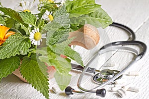 Fresh herb and stethoscope alternative medicine