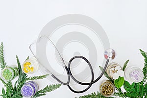 Fresh herb and stethoscope alternative medicine concept with copy space