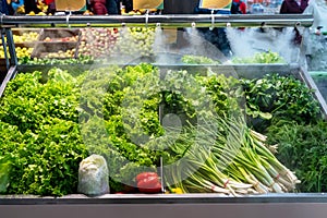 Sale of fresh green vegetables - lettuce salad, parsley, dill, green onions, herbs.