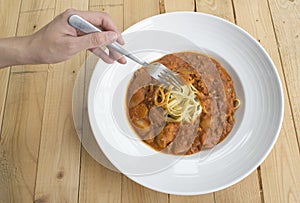 Fresh homecook spaghett on wooden table