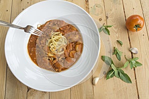 Fresh homecook spaghetti on wooden table