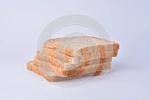 Fresh homemade baked bread and sliced bread isolated on white background