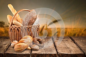 Fresh homemade bread loaves in basket on nature